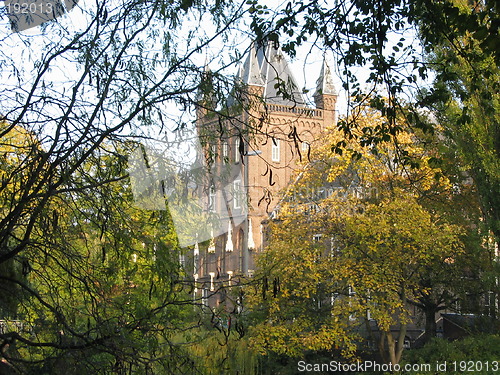 Image of house hidden behind trees