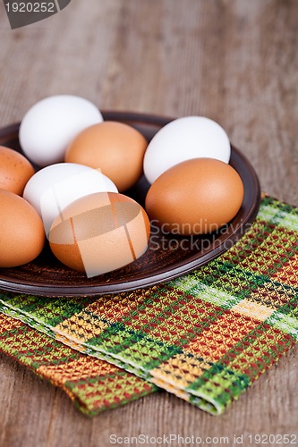 Image of eggs in a plate and towel 