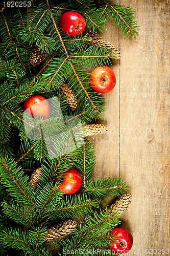 Image of christmas fir tree with pinecones and apples