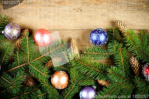 Image of fir tree with pinecones and decorations