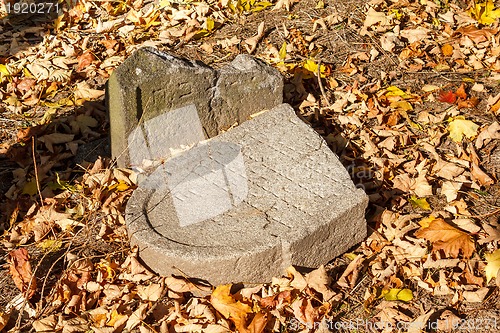 Image of forgotten and unkempt Jewish cemetery with the strangers