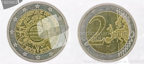 Image of  German 2 Euro coins over black 