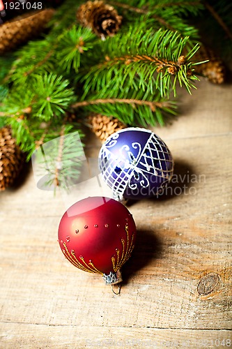 Image of christmas fir tree with pinecones and decorations 