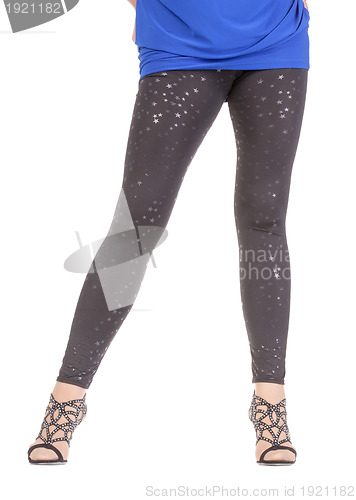Image of Sexy stylish legs in shimmering black leggins
