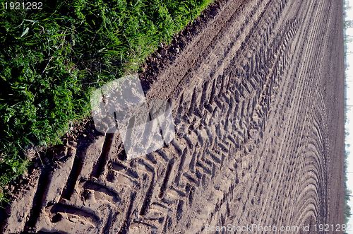 Image of Leveled agricultural field truck wheel mark ground 