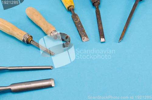 Image of chisel graver carve tools collection on blue 