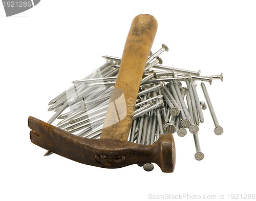 Image of retro rusty hammer nails pile isolated 