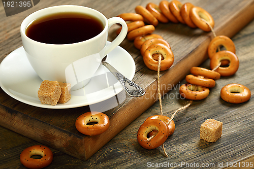 Image of Small bagels in placer and a cup of tea.