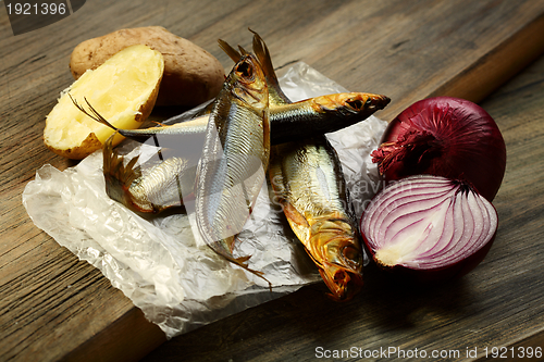 Image of Smoked fish, potatoes and red onion.