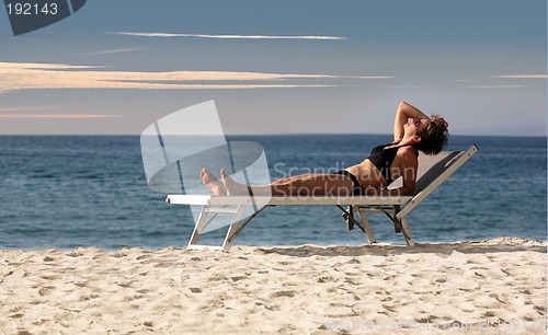 Image of Woman relaxing on a beach