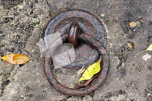 Image of old metal ring on a stone