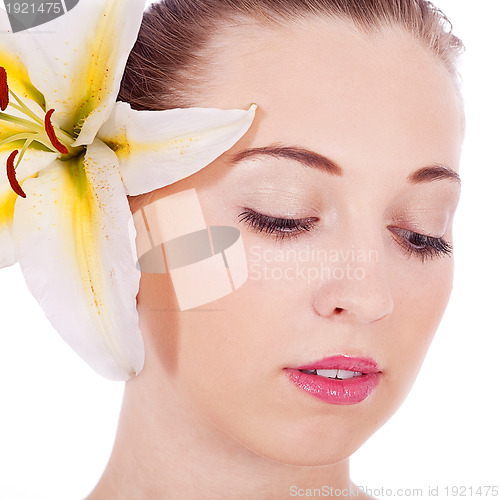 Image of young beautiful woman portrait with white flower