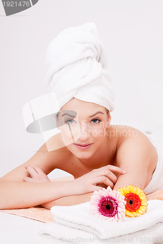 Image of beautiful woman with towel relaxation massage