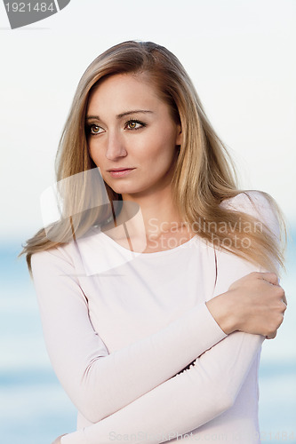 Image of beautiful blonde woman portrait on the beach