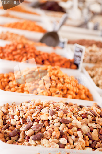 Image of variation of nuts on market outdoor in summer