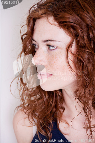 Image of beautiful red head woman with freckle smiling