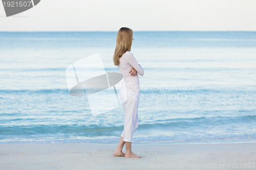 Image of beautiful blonde woman alone at the beach