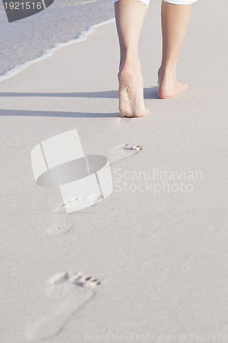 Image of barefoot in the sand in summer holidays