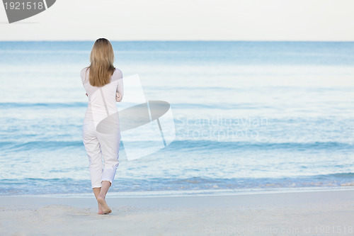 Image of beautiful blonde woman alone at the beach