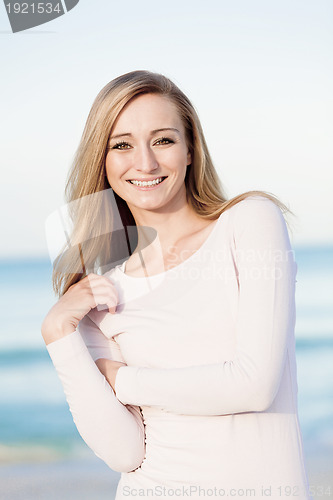 Image of beautiful blonde woman portrait on the beach