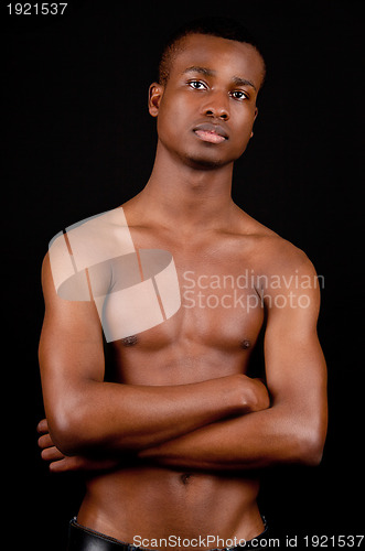 Image of young african man with dark skin looking