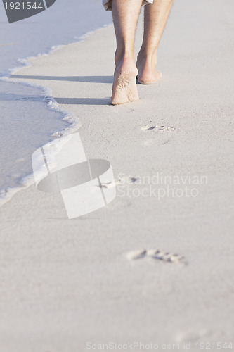 Image of barefoot in the sand in summer holidays