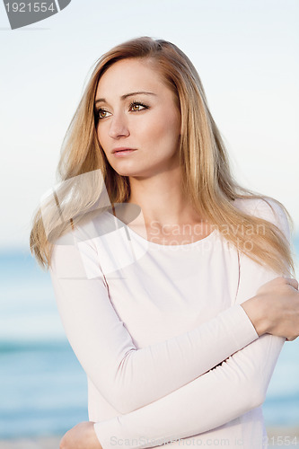 Image of beautiful blonde woman portrait on the beach