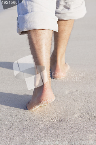 Image of barefoot in the sand in summer holidays