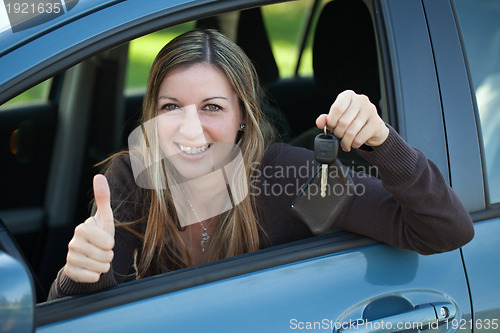 Image of Happy driver with car key