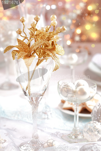 Image of Golden branch on Christmas table