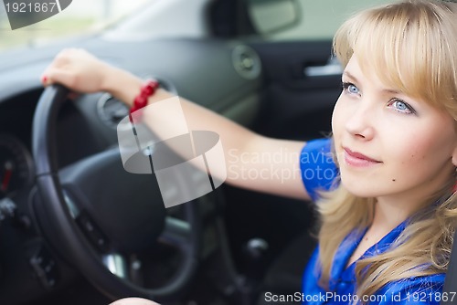 Image of attractive blonde woman driver