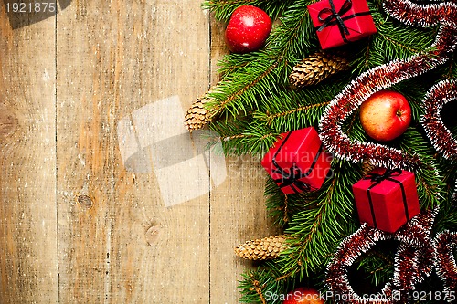 Image of fir tree with pinecones, apples and decorations