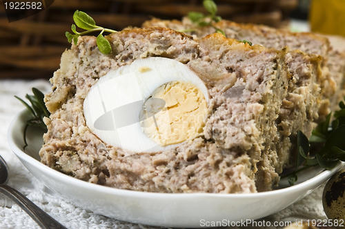 Image of Baked meatloaf with boiled eggs for Easter 