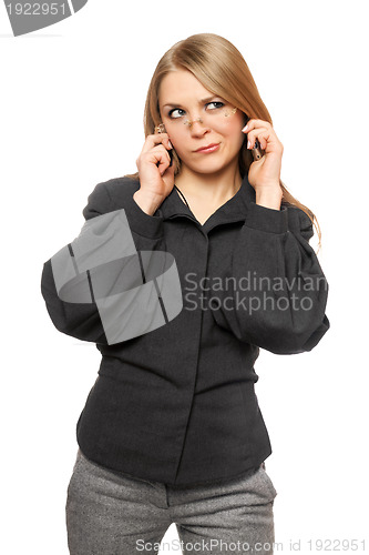 Image of Discontented young blonde in a gray business suit