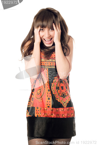 Image of young woman touching her face