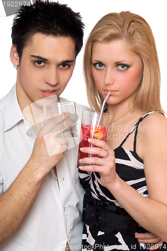 Image of Attractive young couple with cocktails. Isolated