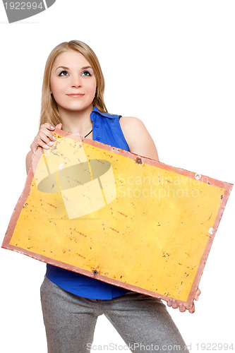 Image of Pretty young woman posing with yellow vintage board