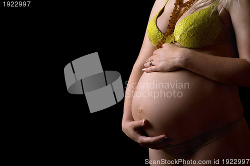 Image of Belly of a pregnant girl. Isolated