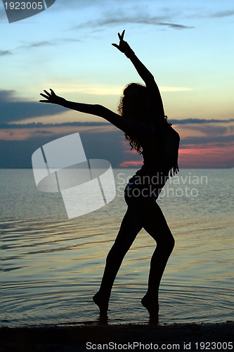 Image of Silhouette of a sexy young woman