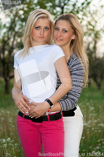 Image of Portrait of two smiling lovely young women
