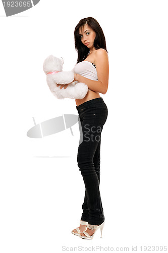 Image of Surprised pretty girl with a teddybear