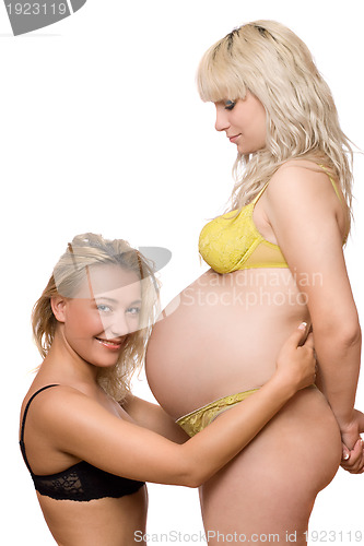 Image of young woman and a pregnant girlfriend