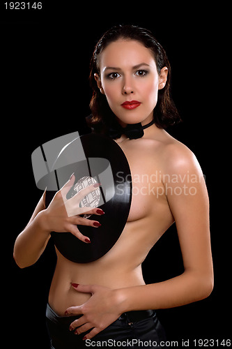 Image of Topless young woman with vinyl