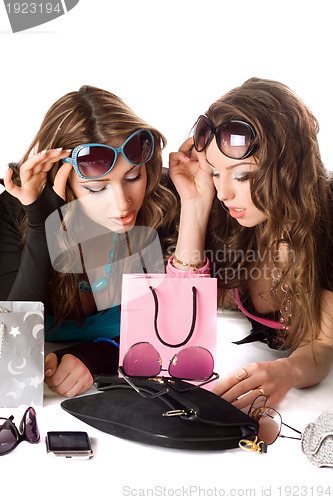 Image of Two pretty girlfriends in sunglasses