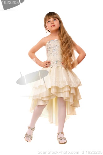 Image of Lovely little girl in a beige dress