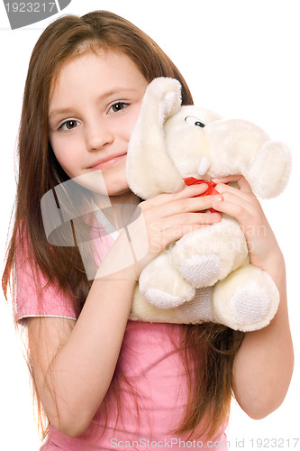 Image of Portrait of little girl with a teddy elephant
