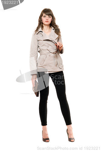 Image of Beautiful girl wearing a coat and black leggings