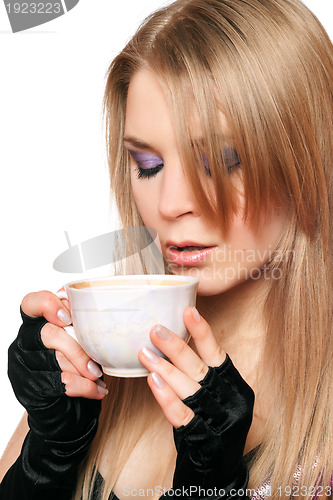 Image of Attractive young blonde with a cup of tea. Isolated