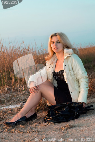 Image of Girl sitting on the beach