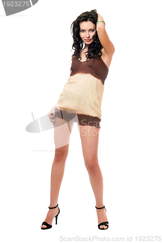Image of Lovely young brunette in a dress. Isolated